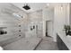 The modern bathroom offers a walk-in shower with black fixtures and a gray double vanity at 60 Newcastle Sw St, Atlanta, GA 30314