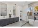 Spacious modern bathroom with backyard views from the soaking tub and a double sink vanity at 60 Newcastle Sw St, Atlanta, GA 30314
