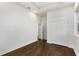 Spacious bedroom featuring dark hardwood floors, tray ceilings, and a large closet at 60 Newcastle Sw St, Atlanta, GA 30314