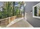 Outdoor deck with wood railings off new construction home at 60 Newcastle Sw St, Atlanta, GA 30314