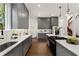 Contemporary kitchen with gray cabinets, quartz countertops, and stainless steel appliances at 60 Newcastle Sw St, Atlanta, GA 30314