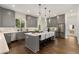 Bright, airy kitchen features a central island, stainless steel appliances, and stylish pendant lighting at 60 Newcastle Sw St, Atlanta, GA 30314