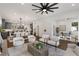 Spacious living room featuring hardwood floors, a stylish ceiling fan, and views of the kitchen at 60 Newcastle Sw St, Atlanta, GA 30314
