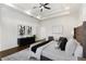 Neutral main bedroom featuring a tray ceiling, sitting area, hardwood floors, and modern decor at 60 Newcastle Sw St, Atlanta, GA 30314