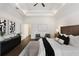Main bedroom featuring dark wood floors, tray ceilings, neutral walls, and modern decor at 60 Newcastle Sw St, Atlanta, GA 30314
