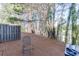 Outdoor space with an iron chair surrounded by trees at 510 Jefferson Chase St, Atlanta, GA 30354