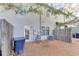Backyard patio space with a trash bin and an iron chair at 510 Jefferson Chase St, Atlanta, GA 30354