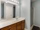 Bathroom featuring a long vanity, framed mirror, shower, and toilet at 510 Jefferson Chase St, Atlanta, GA 30354