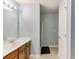 Bathroom featuring a long vanity, framed mirror, shower, and toilet at 510 Jefferson Chase St, Atlanta, GA 30354
