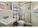 Bathroom with a sink, toilet, and glass door shower at 2384 Cambridge St, Snellville, GA 30078