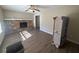 Living room featuring a stone fireplace and wood-look floors at 2656 Del Ridge Dr, Douglasville, GA 30135
