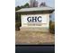 Georgia Highlands College Cartersville Campus entrance sign in front of trees at 45 Eagle Glen Ne Dr, Cartersville, GA 30121