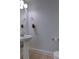 Bathroom with pedestal sink and framed mirror at 221 Semel Nw Cir # 273, Atlanta, GA 30309