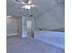 Upstairs bonus bedroom area features carpet, neutral wall paint and access to storage at 221 Semel Nw Cir # 273, Atlanta, GA 30309