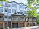 Inviting townhome with a charming covered balcony and attached garages for convenient parking at 221 Semel Nw Cir # 273, Atlanta, GA 30309