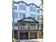Beautiful townhome showcases a private covered front balcony and attached garages at 221 Semel Nw Cir # 273, Atlanta, GA 30309