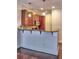 Functional eat-in kitchen featuring a breakfast bar with granite countertops and wood cabinets at 221 Semel Nw Cir # 273, Atlanta, GA 30309