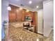 Kitchen featuring stainless steel appliances, including a range, built-in microwave, and granite countertops at 221 Semel Nw Cir # 273, Atlanta, GA 30309