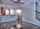 Open-concept living area with hardwood floors and a breakfast bar connecting to the kitchen at 221 Semel Nw Cir # 273, Atlanta, GA 30309