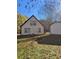 A well-maintained backyard with a cozy fire pit area, mature trees and a shed at 333 Pickfair Sw Way, Atlanta, GA 30315