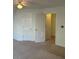 Neutral bedroom space featuring three doors and overhead fan at 333 Pickfair Sw Way, Atlanta, GA 30315