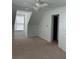 Carpeted bedroom with a ceiling fan and natural light at 333 Pickfair Sw Way, Atlanta, GA 30315