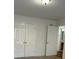 A bright bedroom with a connecting door and a double-doored closet offering ample storage at 333 Pickfair Sw Way, Atlanta, GA 30315