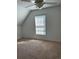 Bright bedroom features a window, carpet, and a ceiling fan at 333 Pickfair Sw Way, Atlanta, GA 30315