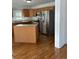 A kitchen featuring stainless steel appliances, an island, and neutral countertops and cabinetry at 333 Pickfair Sw Way, Atlanta, GA 30315