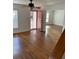 A bright living room boasts hardwood floors, a ceiling fan and a doorway to a secondary room at 333 Pickfair Sw Way, Atlanta, GA 30315