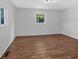 Spacious bedroom featuring wood-look floors and a window at 2142 Cloverdale Se Dr, Atlanta, GA 30316