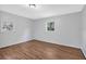 Well-lit bedroom with wood-look floors and multiple windows at 2142 Cloverdale Se Dr, Atlanta, GA 30316