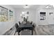 Modern dining room with marble floors and stylish light fixture at 2142 Cloverdale Se Dr, Atlanta, GA 30316