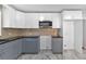 Modern kitchen with gray cabinets, marble floors and stainless steel appliances at 2142 Cloverdale Se Dr, Atlanta, GA 30316