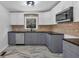 Updated kitchen with gray and white cabinets and marble floors at 2142 Cloverdale Se Dr, Atlanta, GA 30316