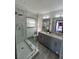 A luxurious bathroom featuring a glass shower with dual vanity, and modern finishes at 1770 South Olympian Sw Way, Atlanta, GA 30310