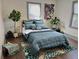 Cozy bedroom with plants, modern decor, a patterned area rug, and dark hardwood floors at 1770 South Olympian Sw Way, Atlanta, GA 30310