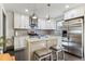 Modern kitchen with stainless steel appliances, island, and stylish backsplash at 1770 South Olympian Sw Way, Atlanta, GA 30310