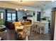 An open-concept living room and kitchen boasts modern lighting, hardwood floors and stainless appliances at 1770 South Olympian Sw Way, Atlanta, GA 30310