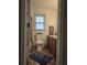 Bathroom with vanity, toilet, and tiled floor is bright with natural light from window at 9031 Par Dr, Douglasville, GA 30134