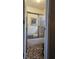 Full bathroom with shower over tub features shower doors and neutral tile flooring at 9031 Par Dr, Douglasville, GA 30134