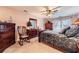Comfortable bedroom with a ceiling fan, window, and decorative dresser and mirror sets a relaxing mood at 9031 Par Dr, Douglasville, GA 30134