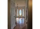 Entryway with hardwood floors and door with stained glass window and side lights at 9031 Par Dr, Douglasville, GA 30134