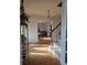 Entryway with hardwood floors and staircase leads to rooms with lots of sunlight at 9031 Par Dr, Douglasville, GA 30134