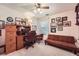 Spacious home office with desk, computer, shelving, seating, and natural light, for a productive work environment at 9031 Par Dr, Douglasville, GA 30134