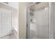 Walk-in shower with glass doors and built-in shelving provides a spa-like experience at 90 Loudoun Dr, Covington, GA 30014