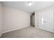 Bedroom with carpet flooring, neutral walls, and double door closet at 90 Loudoun Dr, Covington, GA 30014