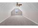 Bonus room with a vaulted ceiling, ceiling fan, carpet floors, and natural light at 90 Loudoun Dr, Covington, GA 30014
