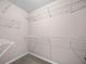 Walk-in closet with ample shelving and storage, ideal for organizing clothes at 90 Loudoun Dr, Covington, GA 30014