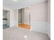 Open concept dining room with hardwood floors, wainscoting, and modern light fixture at 90 Loudoun Dr, Covington, GA 30014